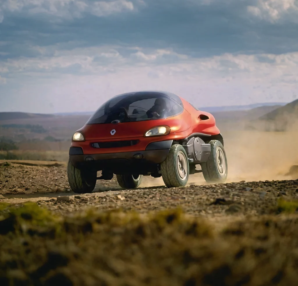 Renault Racoon concept car driving through rugged terrain, showcasing its off-road capabilities