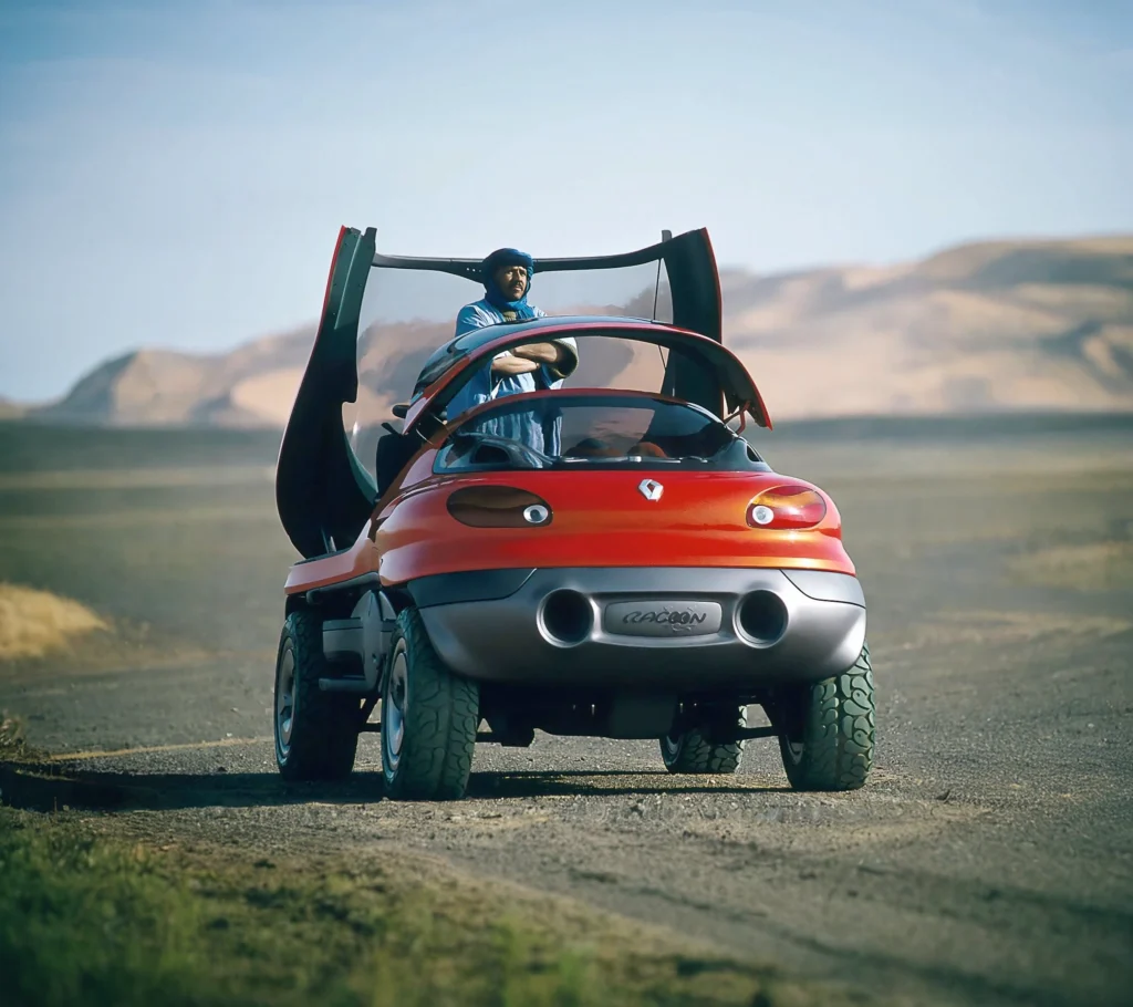Renault Racoon parked next to a lake, demonstrating its amphibious capabilities