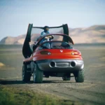 Renault Racoon parked next to a lake, demonstrating its amphibious capabilities