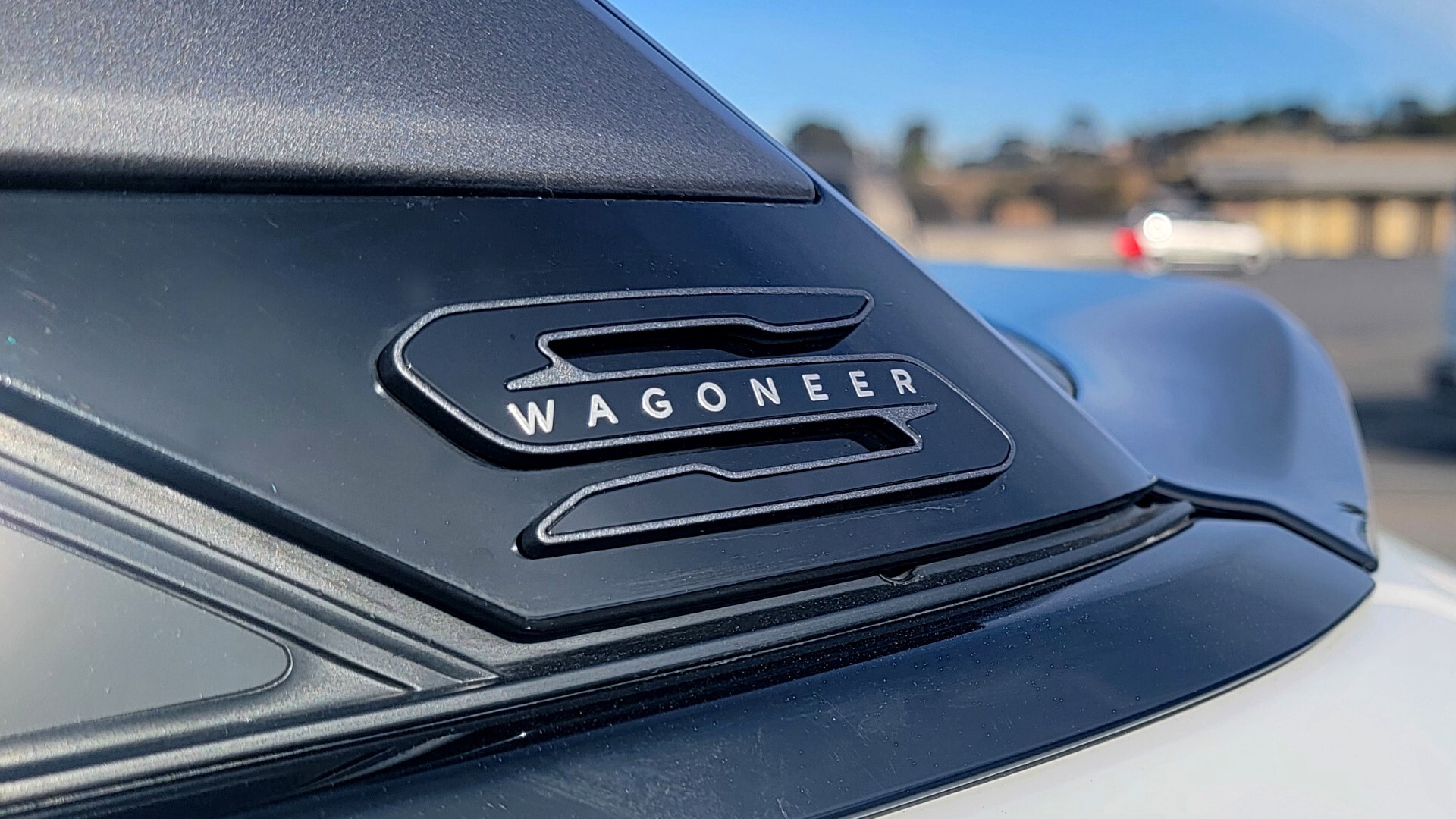 Detailed view of the 2024 Jeep Wagoneer S headlights, featuring LED technology and Jeep's signature design.