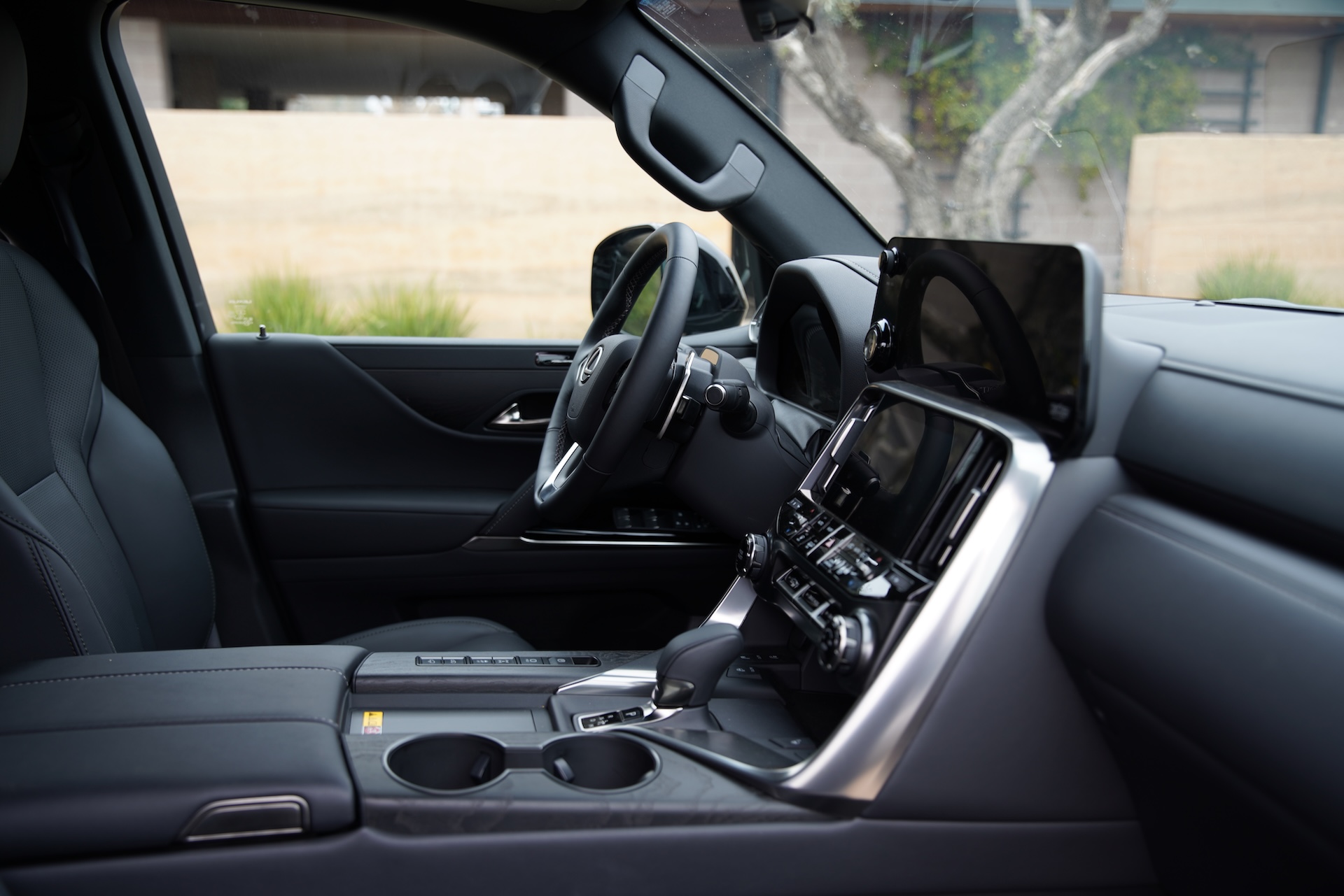 2025 Lexus LX 700h engaged in off-road mode tackling challenging terrain