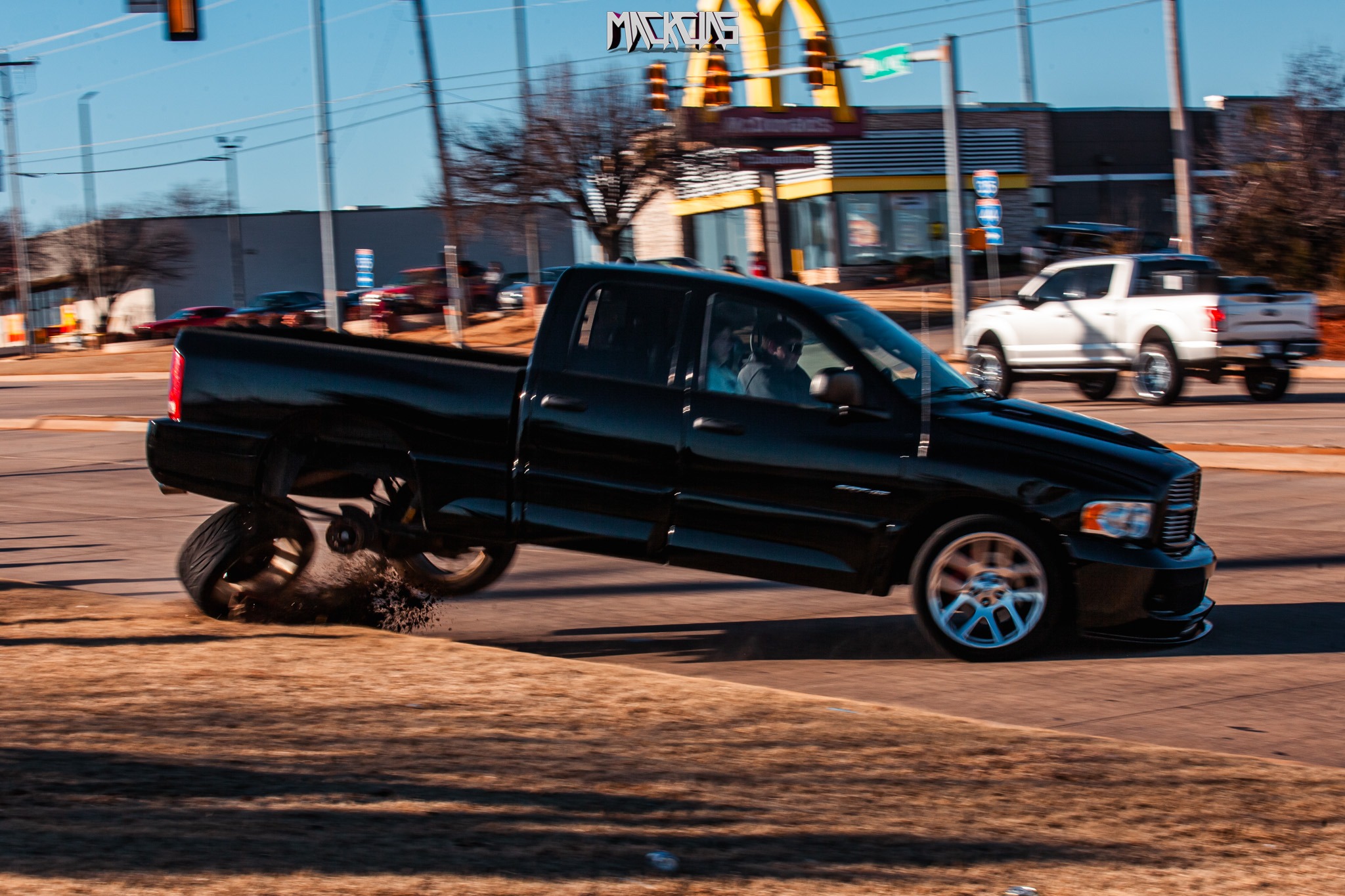 A crowd of enthusiasts and onlookers at a Cars and Coffee event.