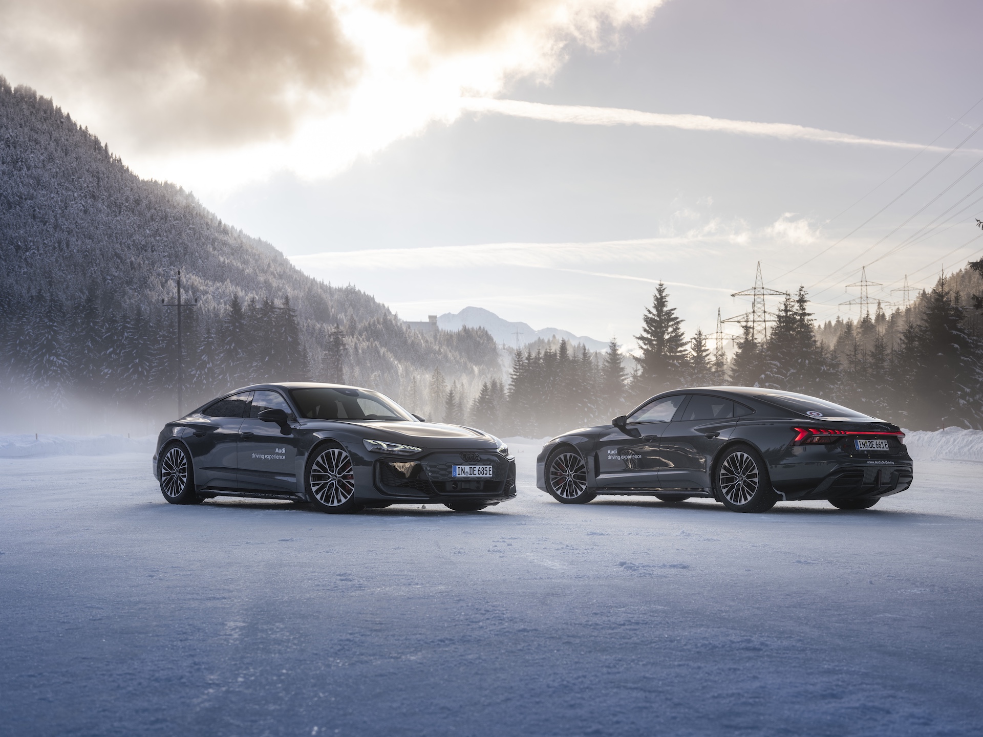 An Audi RS E-Tron GT Performance performing a controlled drift around cones on a skid pad.